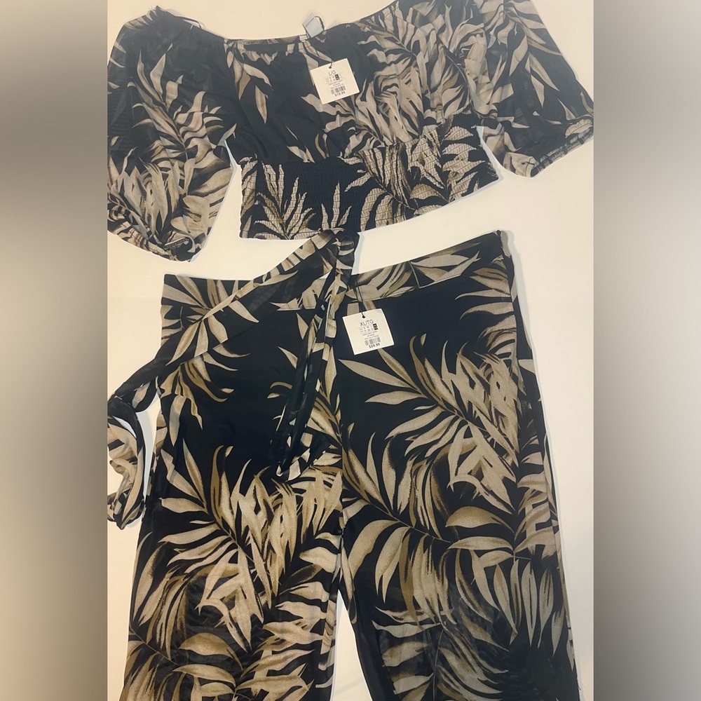 Large off the shoulder crop top with matching XL bottom. Wide sheer slit pants